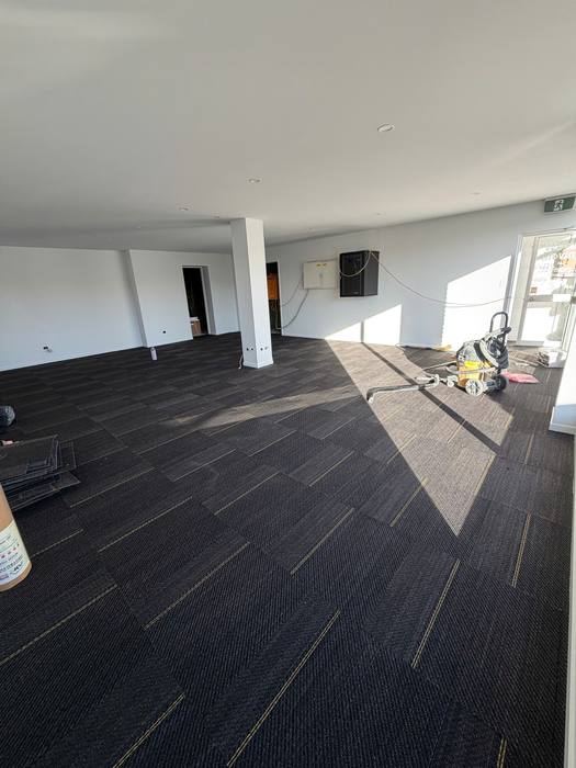Carpet tile installation.