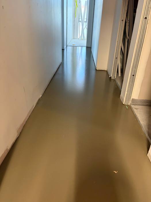 Floor levelling / flood coat application ahead of a new floor install.