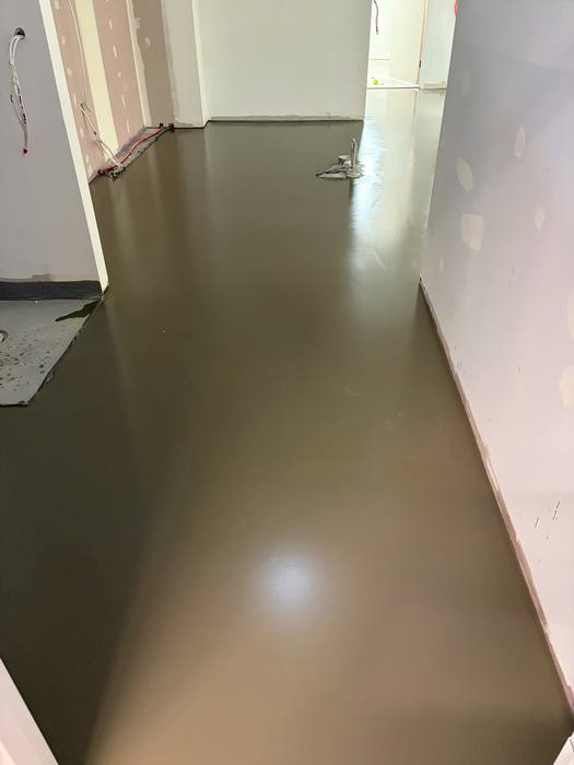 Floor levelling / flood coat application ahead of a new floor install.